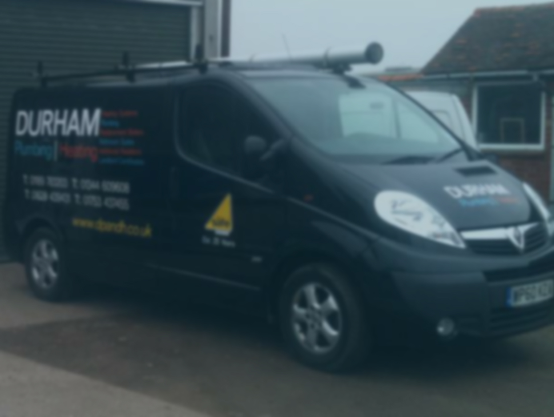 durham plumbing and heating's van parked outside their unit.